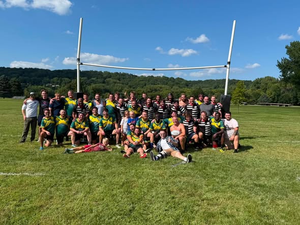 Mankato Marauders RFC team gathered on the pitch in front of the goal posts